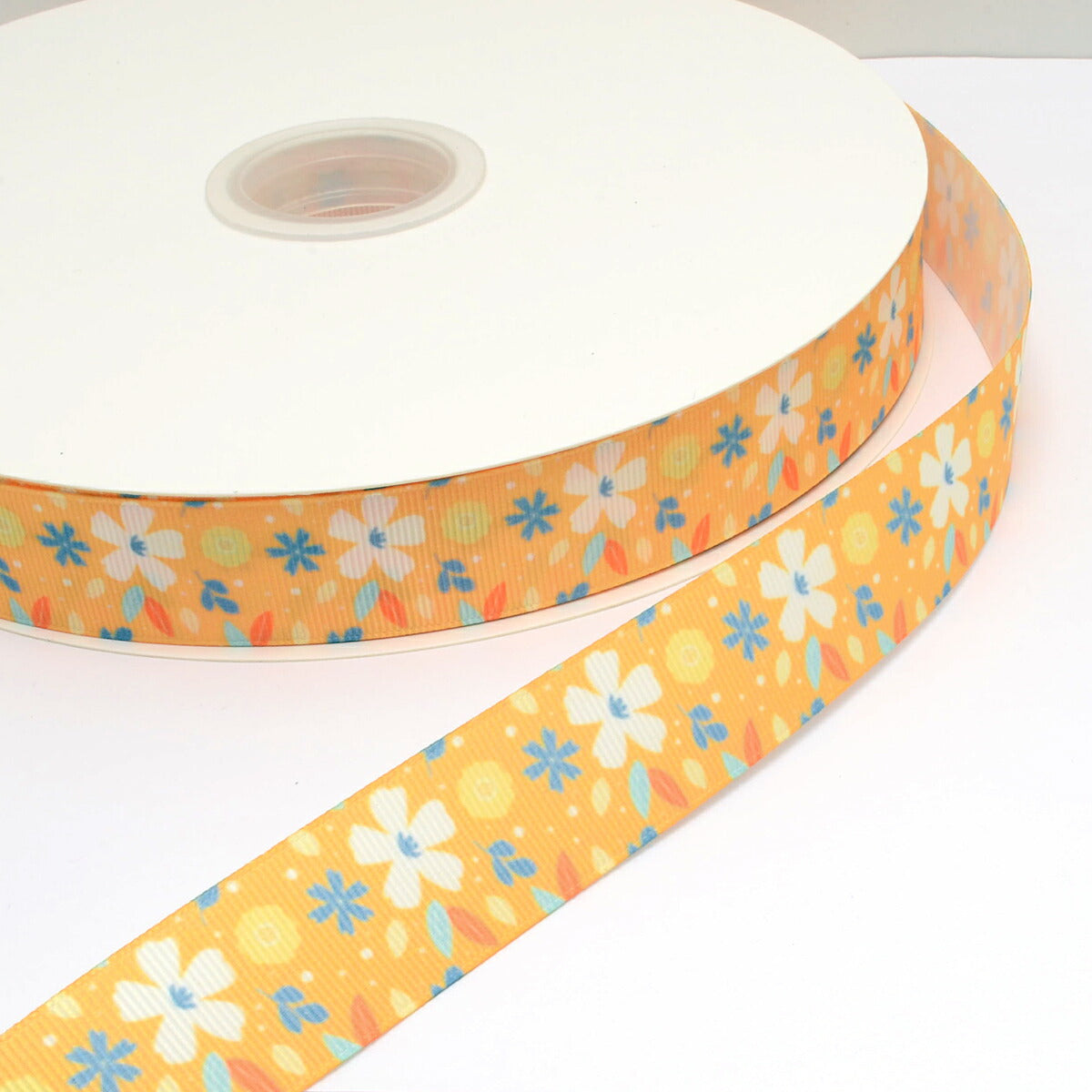 プリントリボンオレンジイエローの花柄リボン幅25mm1m単位切り売り(3m以上)