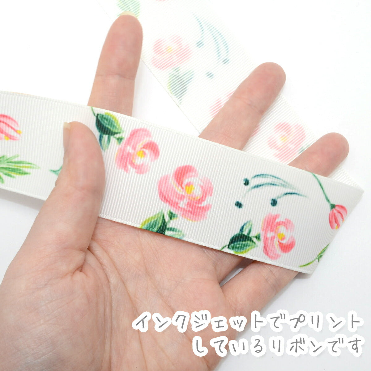プリントリボン風に舞うピンクのお花リボン幅38mm1m単位切り売り(3m以上)「在庫限り」