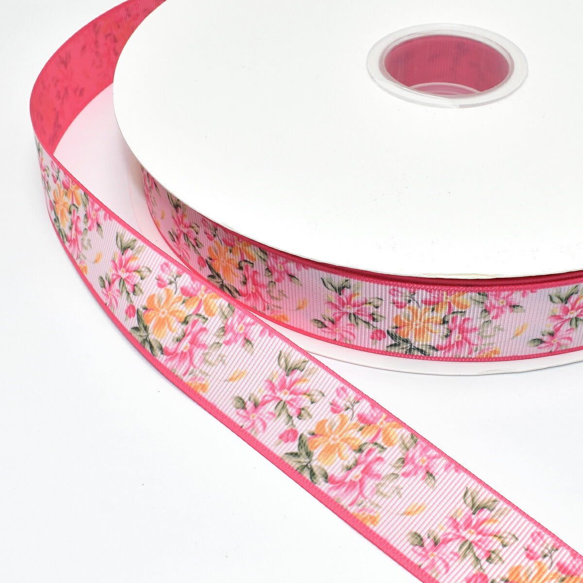 両面プリントリボンピンクとイエローの花柄ダブルフェイスリボン幅25mm1m単位切り売り(2m以上)「在庫限り」