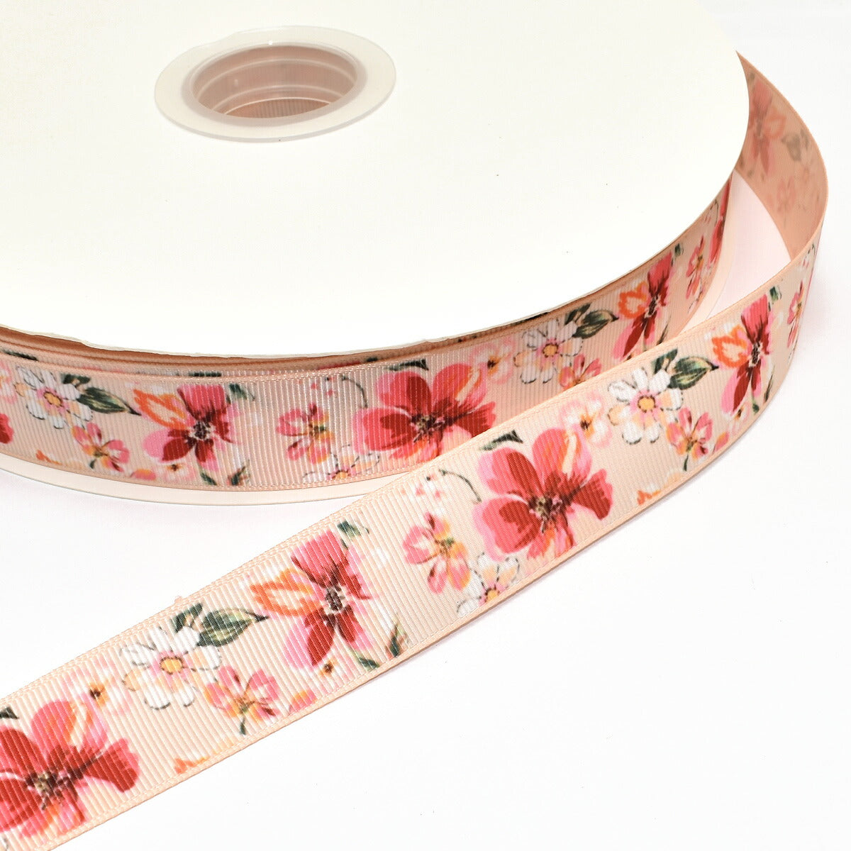 両面プリントリボン風に揺らぐ赤と白とピーチピンクの花柄リボン幅25mm1m単位切り売り(2m以上)