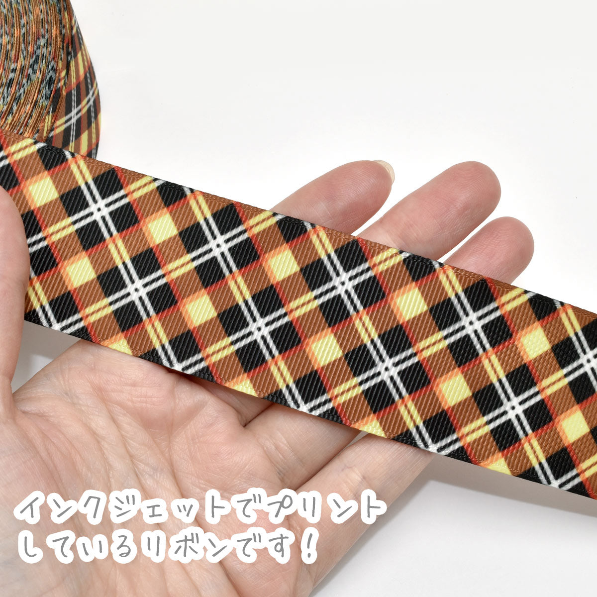 プリントリボン黒とオレンジイエローのチェックリボン幅38mm1m単位切り売り(3m以上)「在庫限り」★