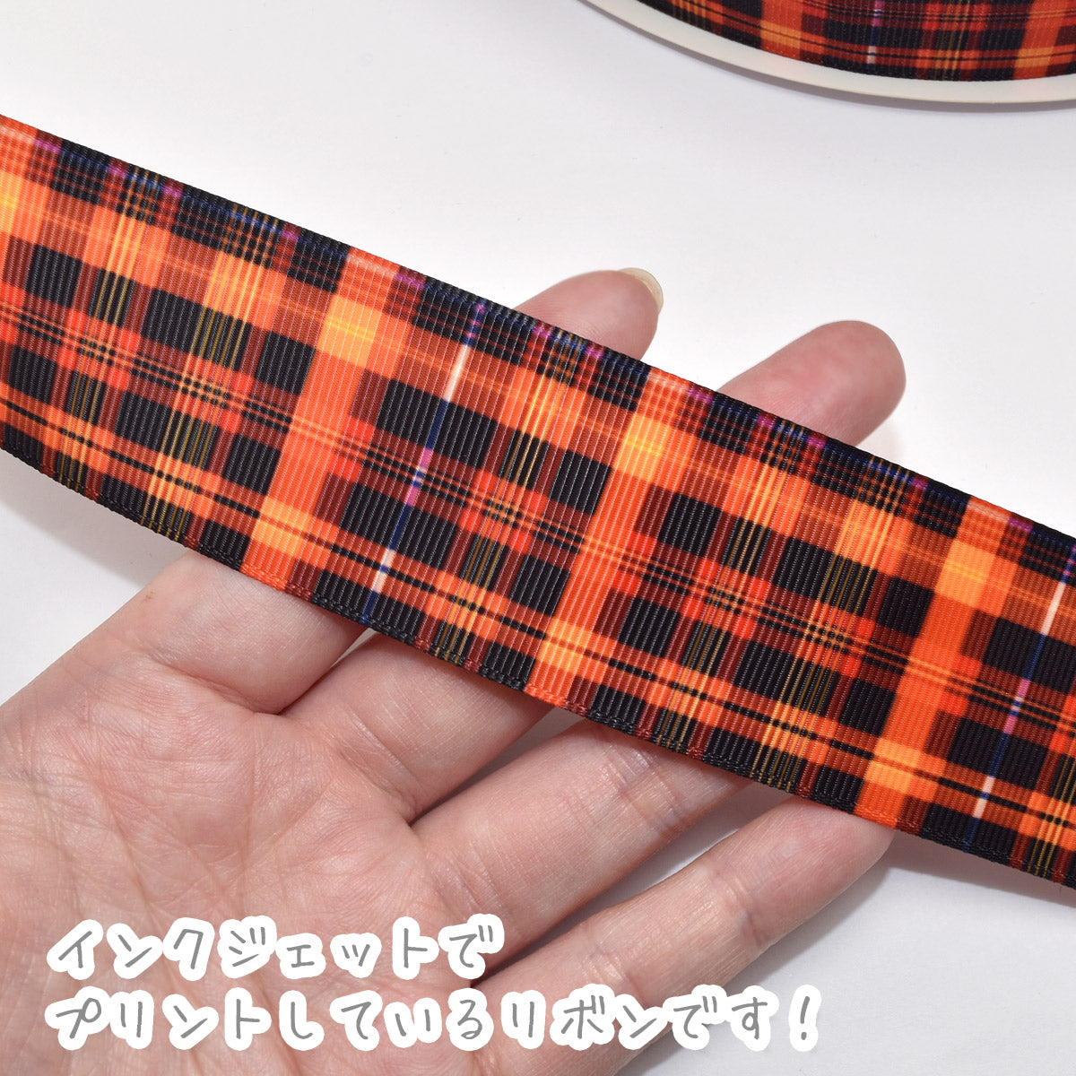 プリントリボンネオンオレンジと黒のチェックリボン幅38mm1m単位切り売り(2m以上)