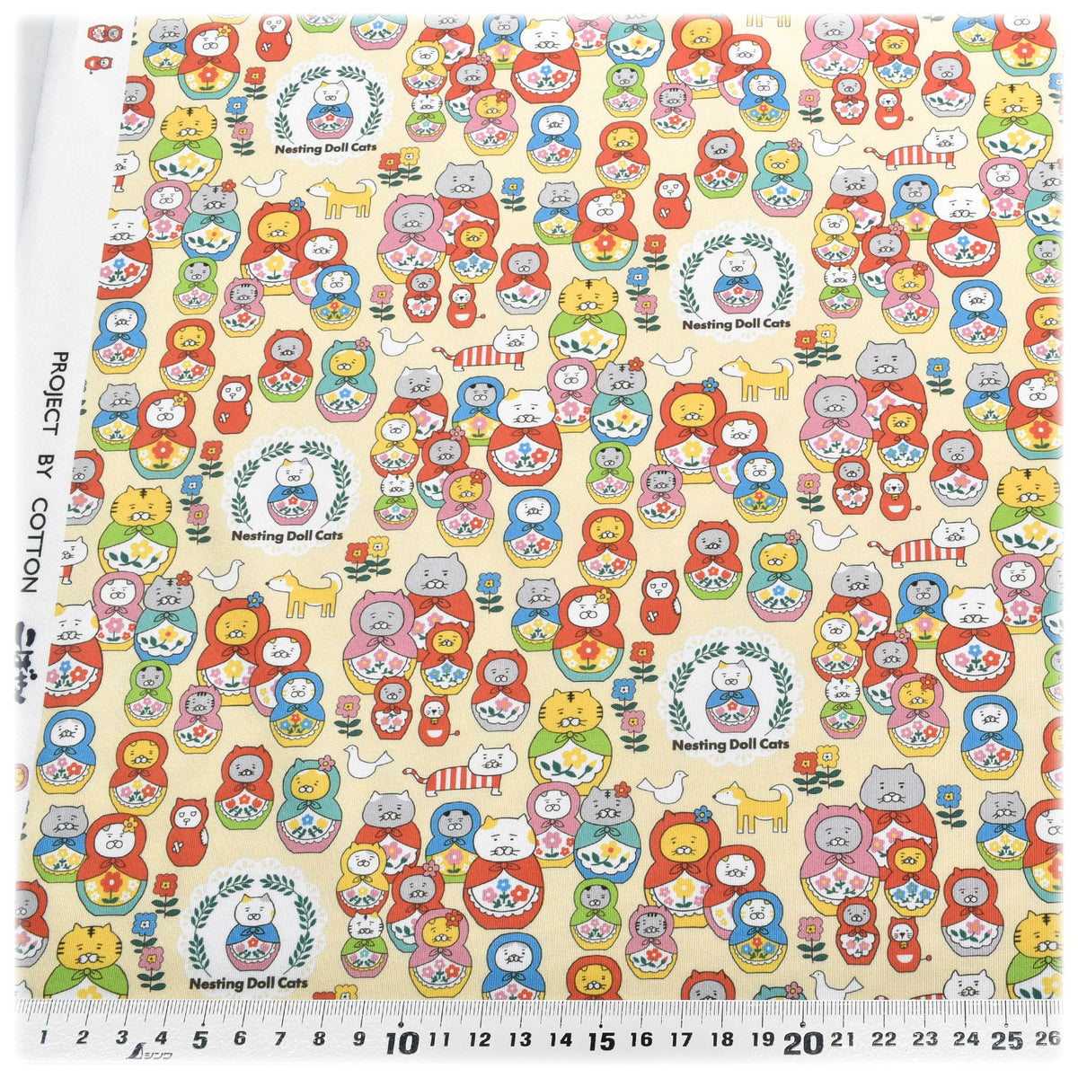ニットネコリョーシカAクリーム系ポリエステルスムースニット生地KDP145-Aコットンこばやし（27）(30cm以上10cm単位切り売り)